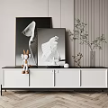 Modern White TV Cabinet with Black Legs Decorated with Paintings Rabbit Figurine and Green Plant