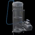 Industrial Equipment Featuring Stainless Steel Cylindrical Tank and Industrial Pump with Blue Hose Connection