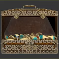 Open Ornate Decorative Jewelry Box With Intricate Carvings And Gold Turquoise Rings