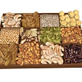 Assorted Nuts And Seeds Arranged In Wooden Tray For Healthy Snack Options
