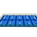 Indoor Basketball Court With Multiple Hoops Blue Flooring And Fenced Surroundings