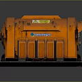 Orange Industrial Machinery With Warning Label And Gauge On Black Base