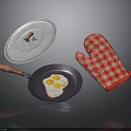 Kitchen Cooking Tools Setup With Frying Pan Fried Egg Lid And Checkered Oven Mitt