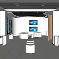 Modern Exhibition Hall Interior With Multiple Screens And White Circular Display Stand