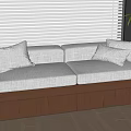 Cozy Window Seat with Soft Cushions Wooden Base and Green Plant in Modern Interior