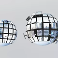Two Digital Sphere Displays Made Of Screens Showing Urban Cityscape With Fragmented Design