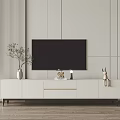 Modern White TV Stand Under Wall Mounted TV With Decorative Plant And Rabbit Figurine