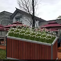 Decorative Red Wooden Garden Planter With Metal Frame And White Flowers Green Plants