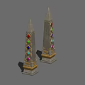 Two Tall Towers With Colorful Gems And Pointed Tops On Decorative Bases