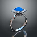 Intricately Sculpted Silver Ring With Blue Gemstone And Decorative Band Carvings