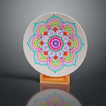 Intricate White Ceramic Plate Sculpture with Colorful Mandala Pattern on Orange Base