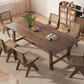 Wooden Dining Table Set With Six Rattan Back Chairs And Potted Plant Fruit Bowl Book