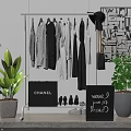 White Clothes Rack With Hanging Clothes CHANEL Sign Shoes New Arrivals Board And Decorative Plants
