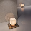 Square Table Lamp With White Lampshade Dark Base On Light Colored Tabletop Gray Wall
