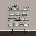 Assorted Kitchenware Displayed on Metal Shelf with Plates Bowls Cups and Jars