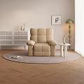 Beige Single Recliner Sofa on Round Rug with Green Floor Lamp and Side Table