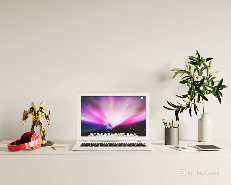 Laptop on Work Desk with Vibrant Screen Red Headphones Robot Figurine and Green Plant 3d model 