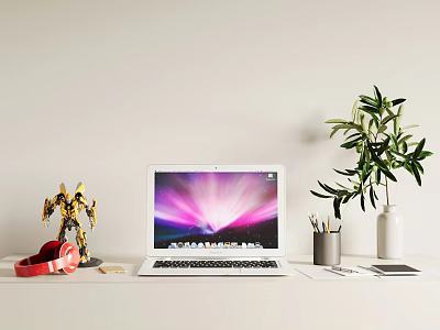 Laptop on Work Desk with Vibrant Screen Red Headphones Robot Figurine and Green Plant 3d model