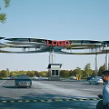 Modern Entrance Gate Structure With LOGO On Top And Cars In Parking Area