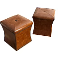 Two Square Brown Leather Stools With Detailed Stitching And Central Stud Design