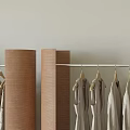 Modern Clothing Store with Stylish Clothing Racks Hanging Neutral Tones Apparel in Minimalist