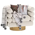 Plush Leisure Chair With Rounded Armrests Geometric Pillows And Plaid Pom Pom Throw
