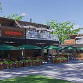 Commercial Street With Outdoor Dining Area Green Umbrellas And Flower Boxes