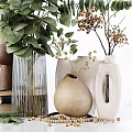 Decorative Ornament Combination Featuring Green Plants Vases Stacked Books And White Candles