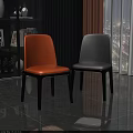 Modern Orange and Gray Upholstered Dining Chairs with Black Legs in Room Interior