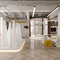 Modern Bridal Shop Interior With White Wedding Dresses On Golden Hangers