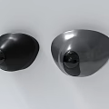 Round Shape Black and Silver Security Cameras Mounted on White Wall