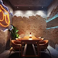 Stylish Private Dining Room With Neon Sign Brick Wall Long Wooden Table And Orange Chairs