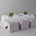 Simple Dining Table And Chairs Set With White Tablecloth Green Plants And Chandelier