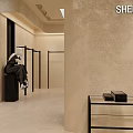 Minimalist Modern Clothing Store Interior With Beige Walls Hanging Racks Black Furniture And Plant Decor