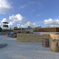 Outdoor Military Training Ground Featuring Watchtower Brick Walls Tires Barrels And Gravel Surface