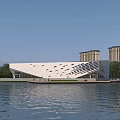 Modern Waterfront White Museum Building With Geometric Glass Facade Trees And High Rise Background