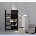 Modern Dark Wood Bookcase With Layered Shelves Accent Chair And Floor Lamp