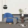 Blue Textured Accent Chair by Fireplace with Dried Plant Vase and Pendant Light