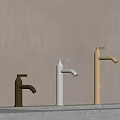 Black White And Gold Modern Faucets On Light Bathroom Countertop With Beige Wall