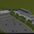 Modern Industrial Plant Building With Surrounding Green Trees And Road Vehicle Access