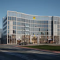 Modern Office Building With Glass Curtain Wall Street Cars Pedestrians And Trees