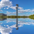 Illuminated Landscape Sculpture With Three Towers Olympic Rings And City Water Reflection