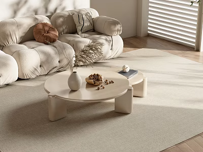 Modern Living Room Featuring Round Beige Coffee Table With Vase Nuts Book And Sofa 3d model