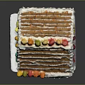 Gingerbread House Decorated with White Striped Icing and Colorful Candies on Roof and Windows