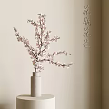 White Cylindrical Vase With Pink Cherry Blossom Branches In Indoor Floral Setting