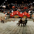 Traditional Commercial Street With Stone Paved Pathway Outdoor Tables Red Lanterns And String Lights