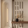 Modern Entryway Hallway With Arched Wall Perforated Partition Wooden Console Table And Circular Wall Lamp
