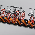 Bicycles in a row with orange wheels on orange rack black floor