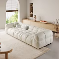 Plush White Sectional Sofa in Modern Living Room with Decorative Pillows Wooden Cabinet and Greenery