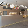 Sweet Dessert Shop Interior With Glass Display Cases And Fresh Pastries